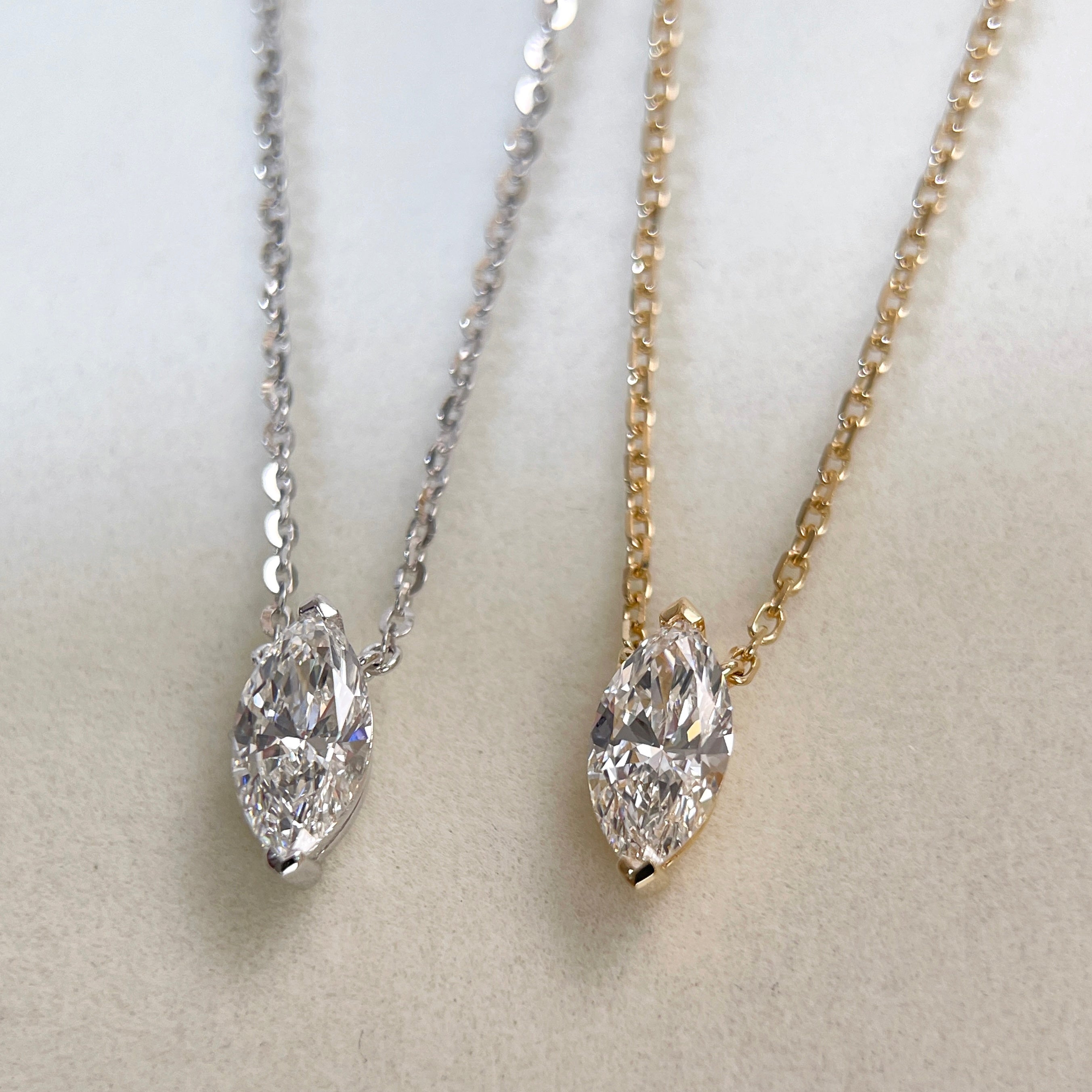 18K yellow gold and silver-tone marquise lab grown diamond necklace comparison.