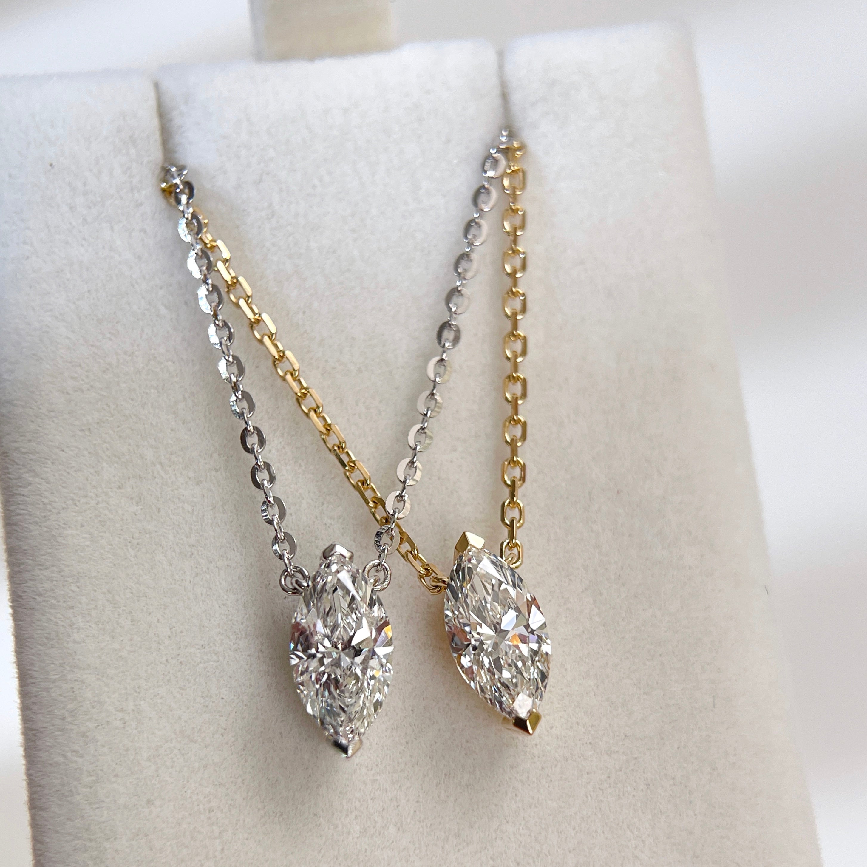 18K yellow gold and silver-tone marquise lab grown diamond necklace comparison.