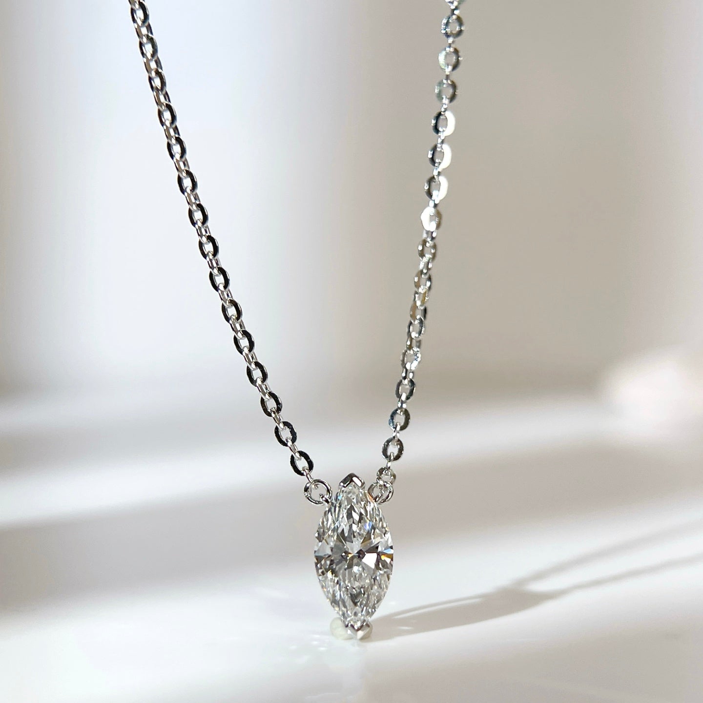 Front presentation of a 1 carat D/VVS2 marquise lab grown diamond necklace in S925 sterling silver.