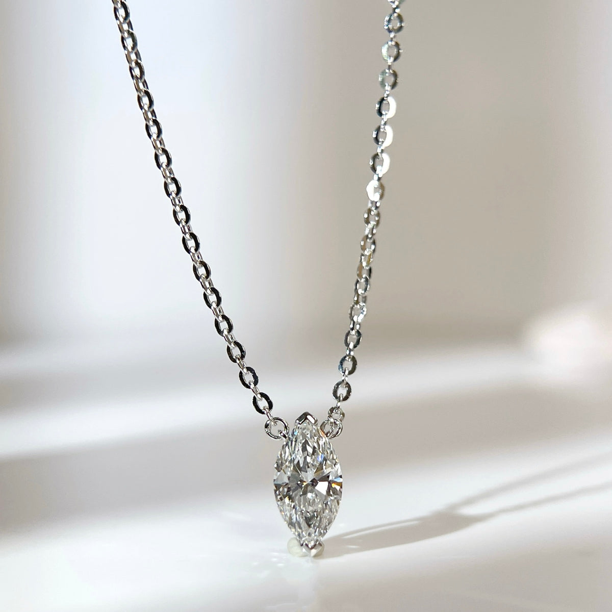 Front presentation of a 1 carat D/VVS2 marquise lab grown diamond necklace in S925 sterling silver.