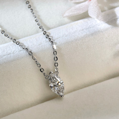 Jewelry display of a 1 carat marquise lab grown diamond necklace in S925 sterling silver.