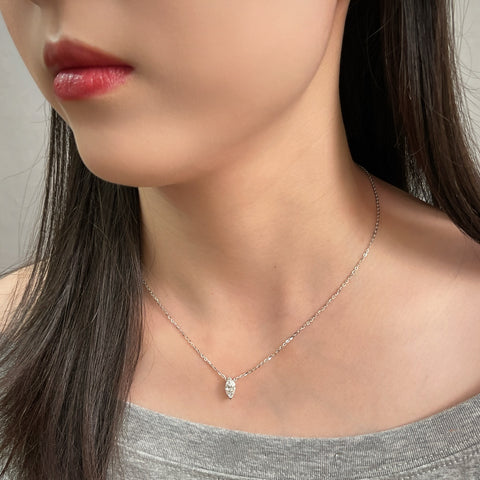Model wearing a 1 carat marquise lab grown diamond necklace in S925 sterling silver.