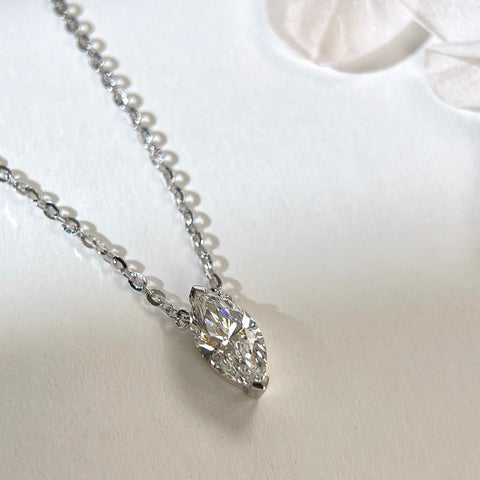 Angled view of a 1 carat marquise lab grown diamond necklace in S925 sterling silver.