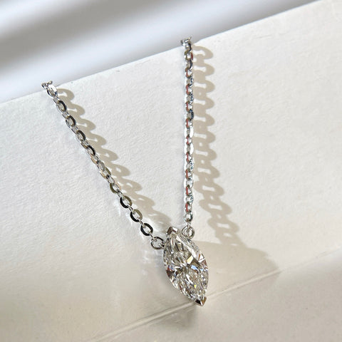 Close-up of a 1 carat marquise lab grown diamond necklace in S925 sterling silver.