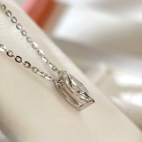 Side view showing the two-prong setting of a 1 carat marquise lab grown diamond necklace in S925 sterling silver.