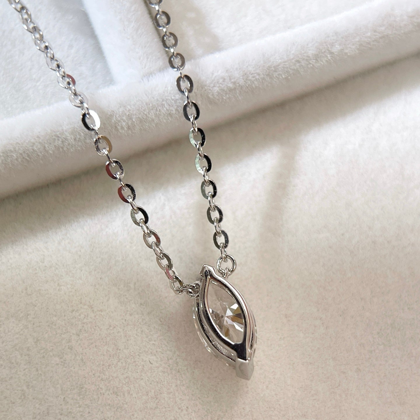 Back view showing the two-prong setting of a 1 carat marquise lab grown diamond necklace in S925 sterling silver.