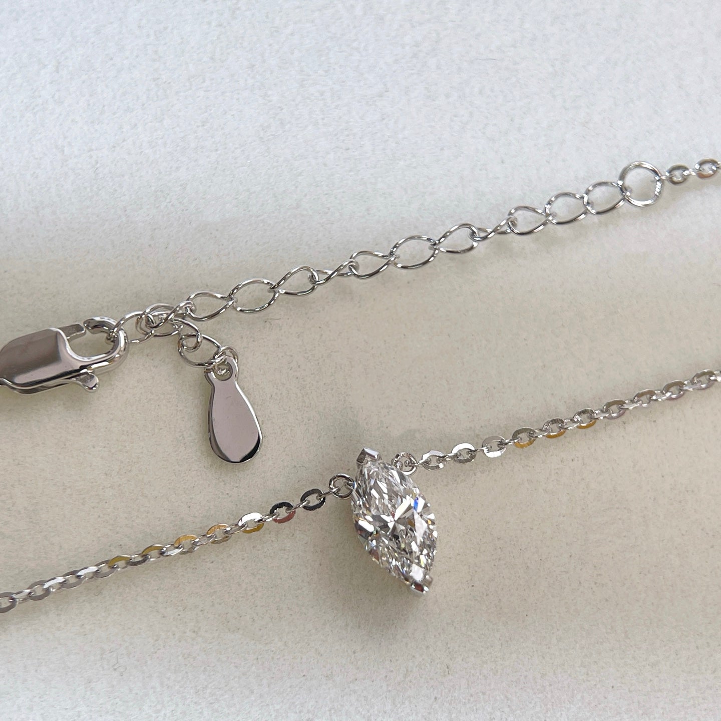 Chain and clasp detail of a 1 carat marquise lab grown diamond necklace in S925 sterling silver.