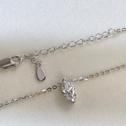 Chain and clasp detail of a 1 carat marquise lab grown diamond necklace in S925 sterling silver.