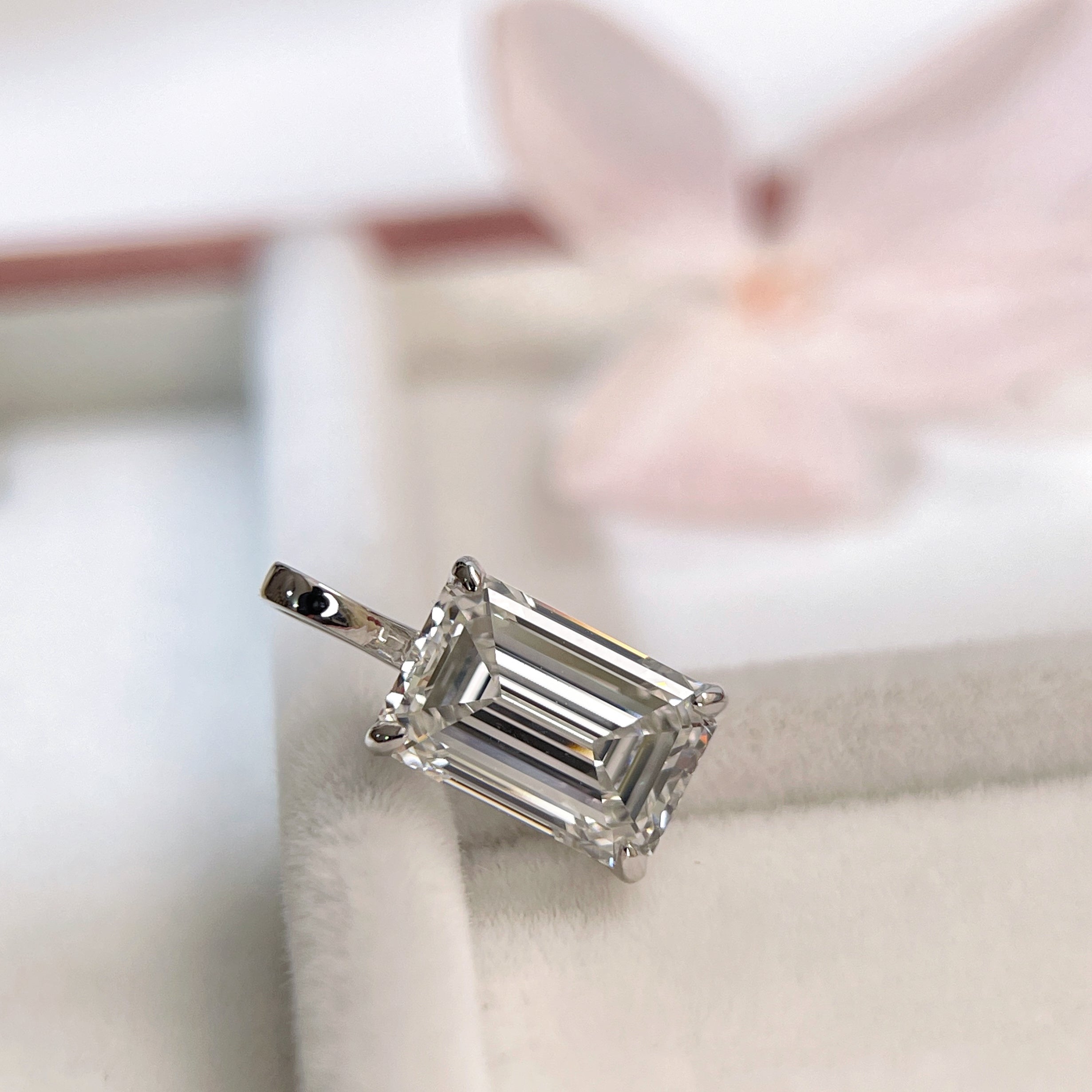 2 ct emerald-cut lab grown diamond pendant in 18K white gold with a four-prong setting