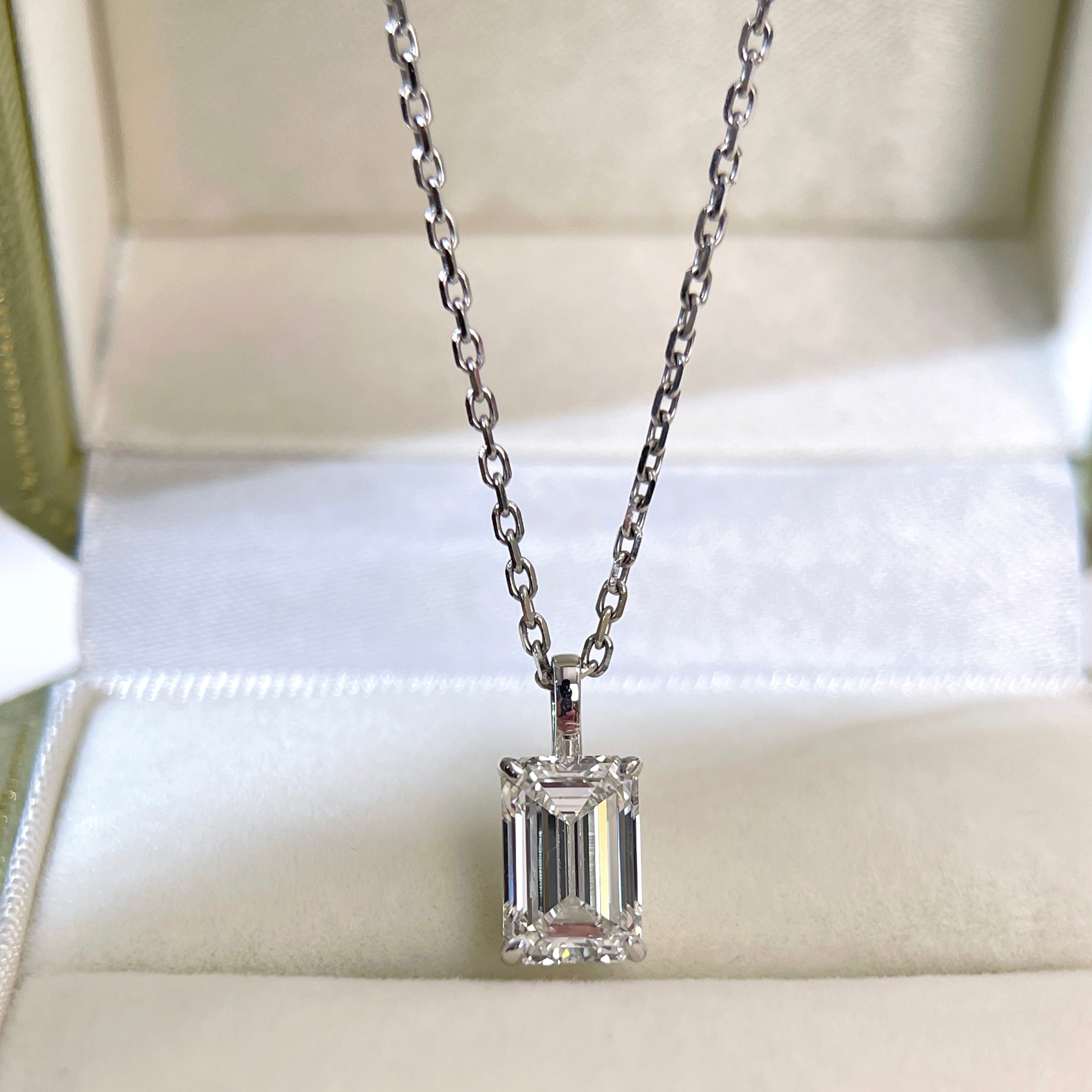 2 ct emerald-cut lab grown diamond 18K white gold pendant displayed with its separate chain