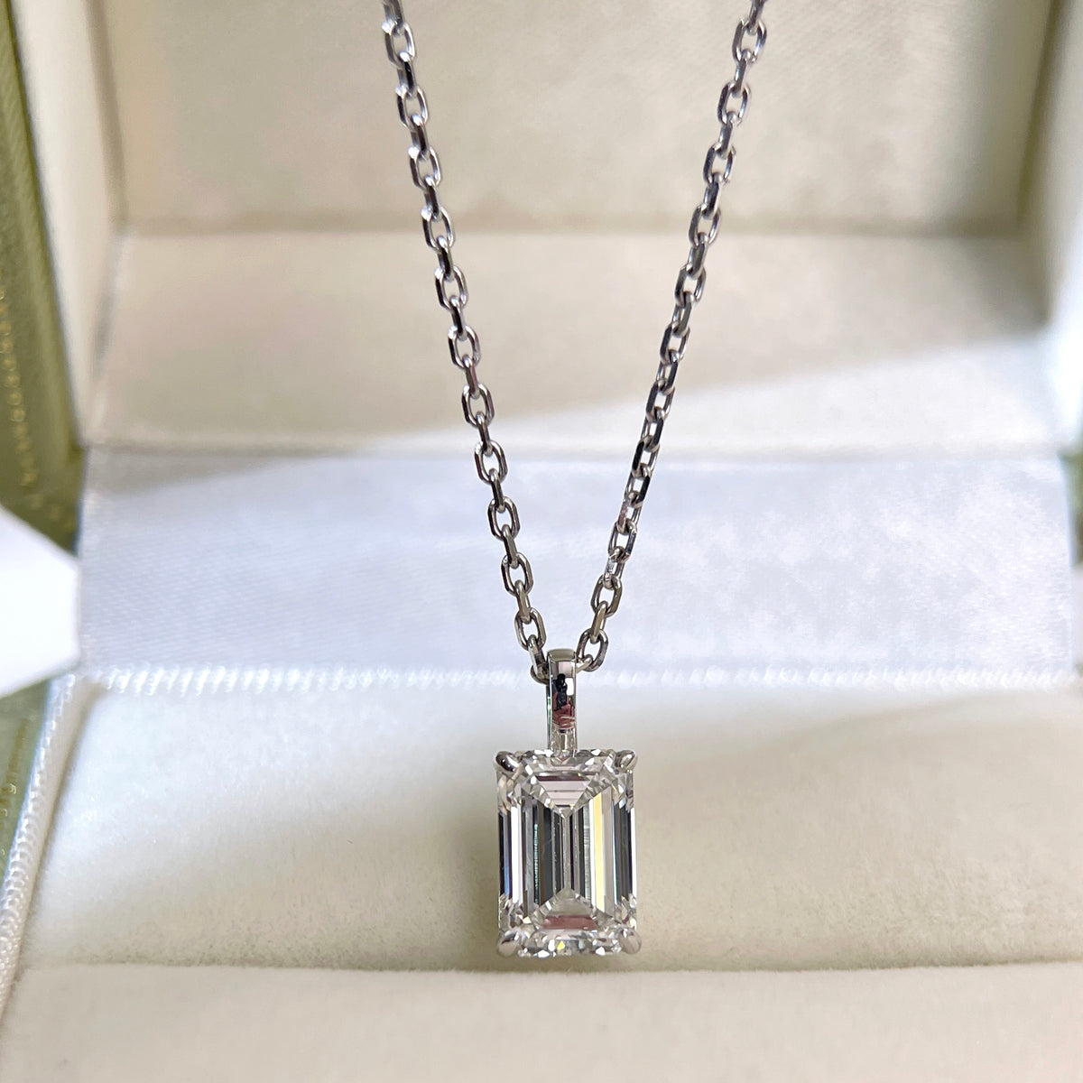 2 ct emerald-cut lab grown diamond 18K white gold pendant displayed with its separate chain