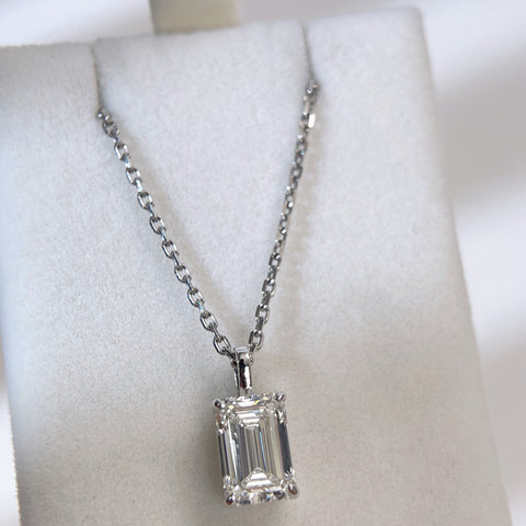 Wide display of a detachable emerald-cut lab grown diamond pendant and chain