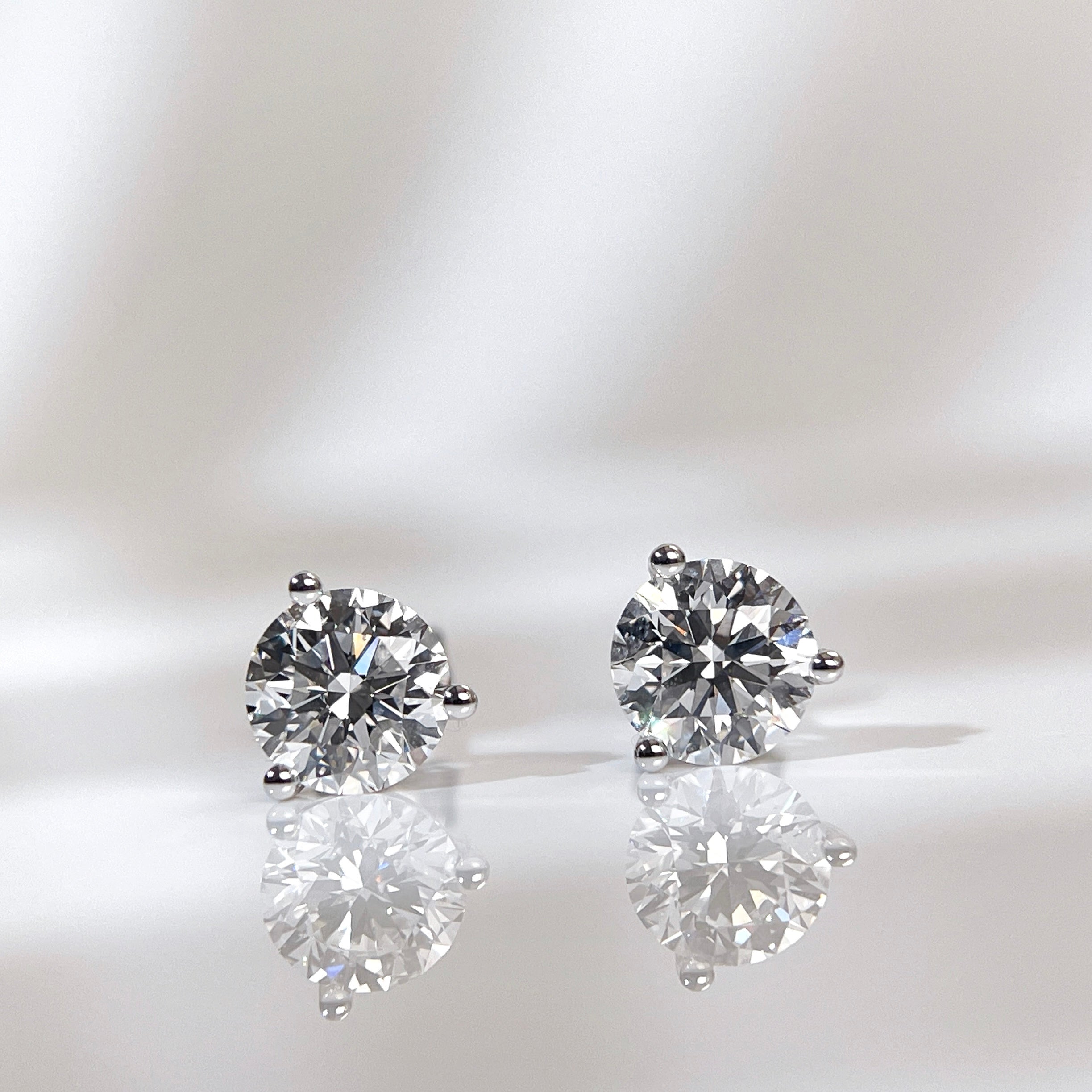 IGI certified 2 CTW round lab grown diamond three-prong Martini stud earrings in 14K white gold