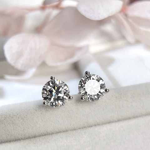 Lifestyle display of D VVS2 round lab grown diamond Martini stud earrings