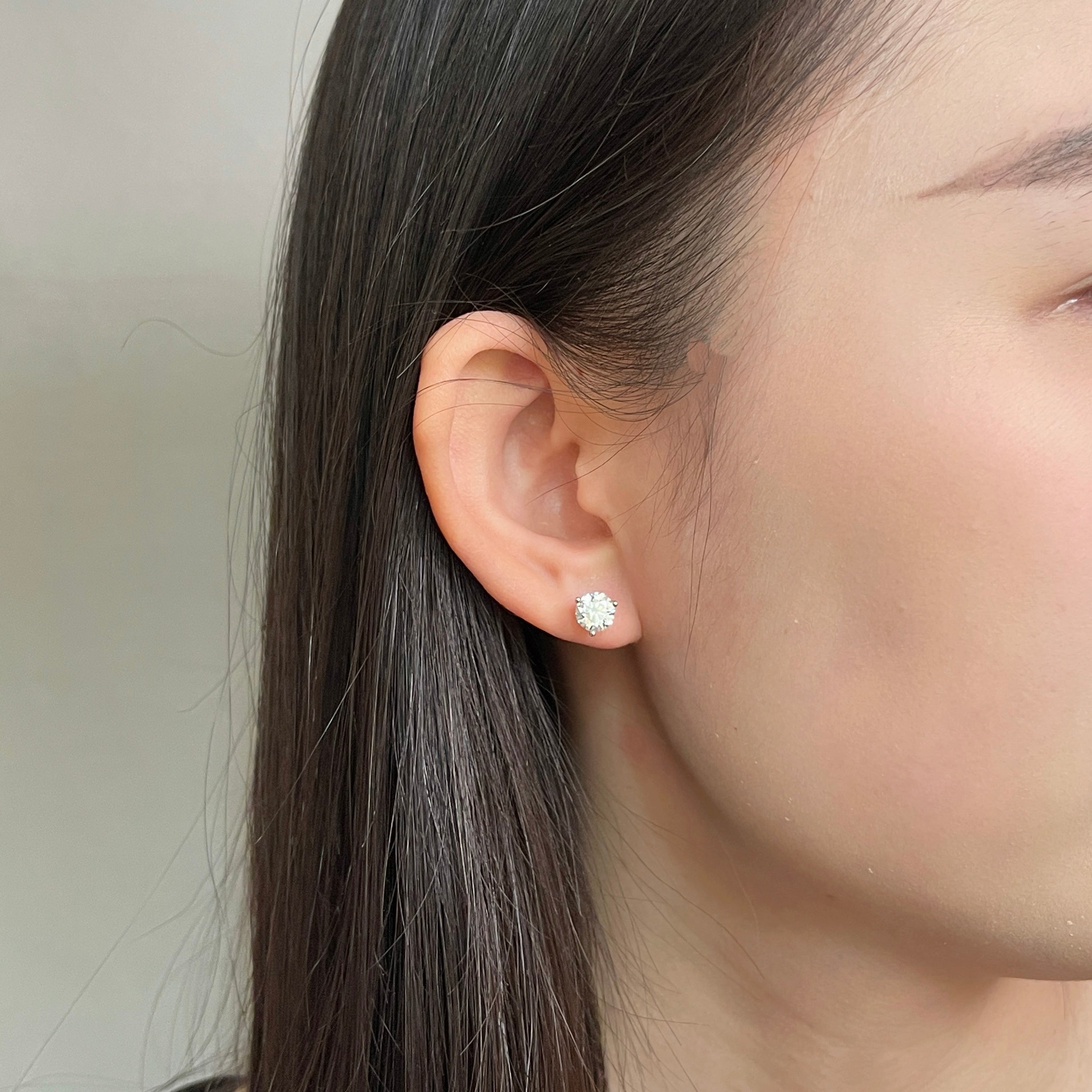 Opposite ear view of a 1 carat round lab grown diamond Martini stud earring