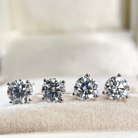Front comparison of four-prong and three-prong Martini round diamond stud settings