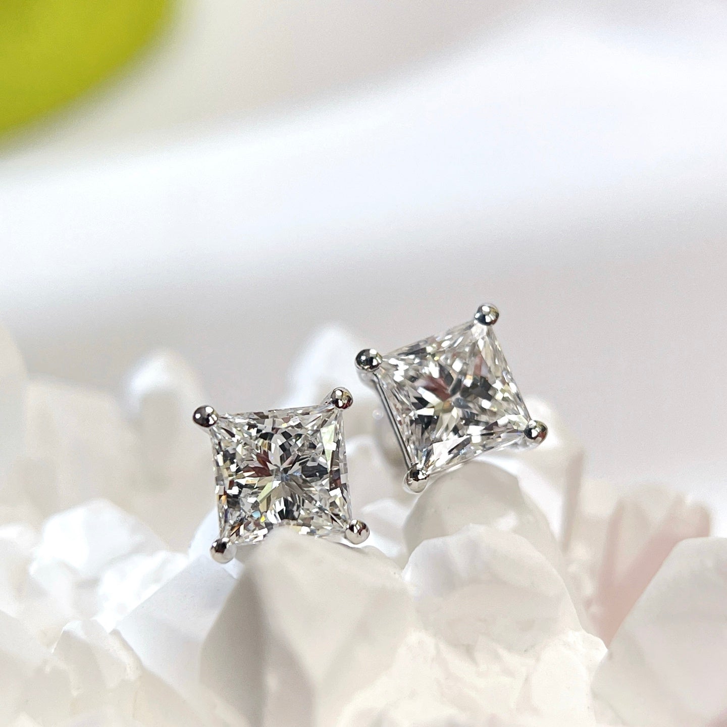 Front display view of 2 CTW princess-cut lab-grown diamond stud earrings