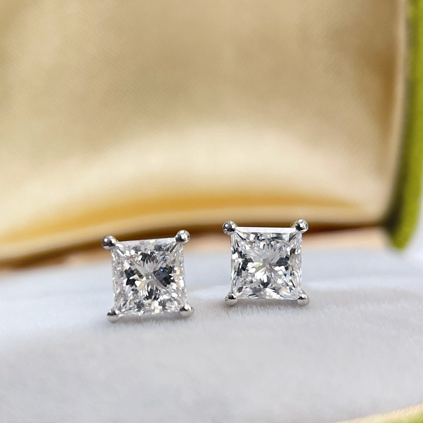 Close-up front view of 1 carat princess-cut lab-grown diamonds
