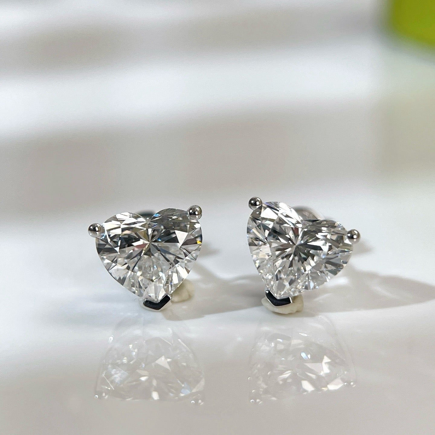 IGI certified 3 CTW heart-shaped lab-grown diamond three-prong stud earrings in 18K white gold