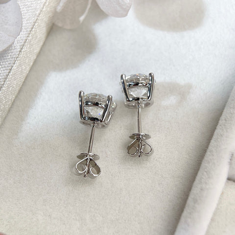 Back view of 18K white gold four-prong stud earrings with push backs