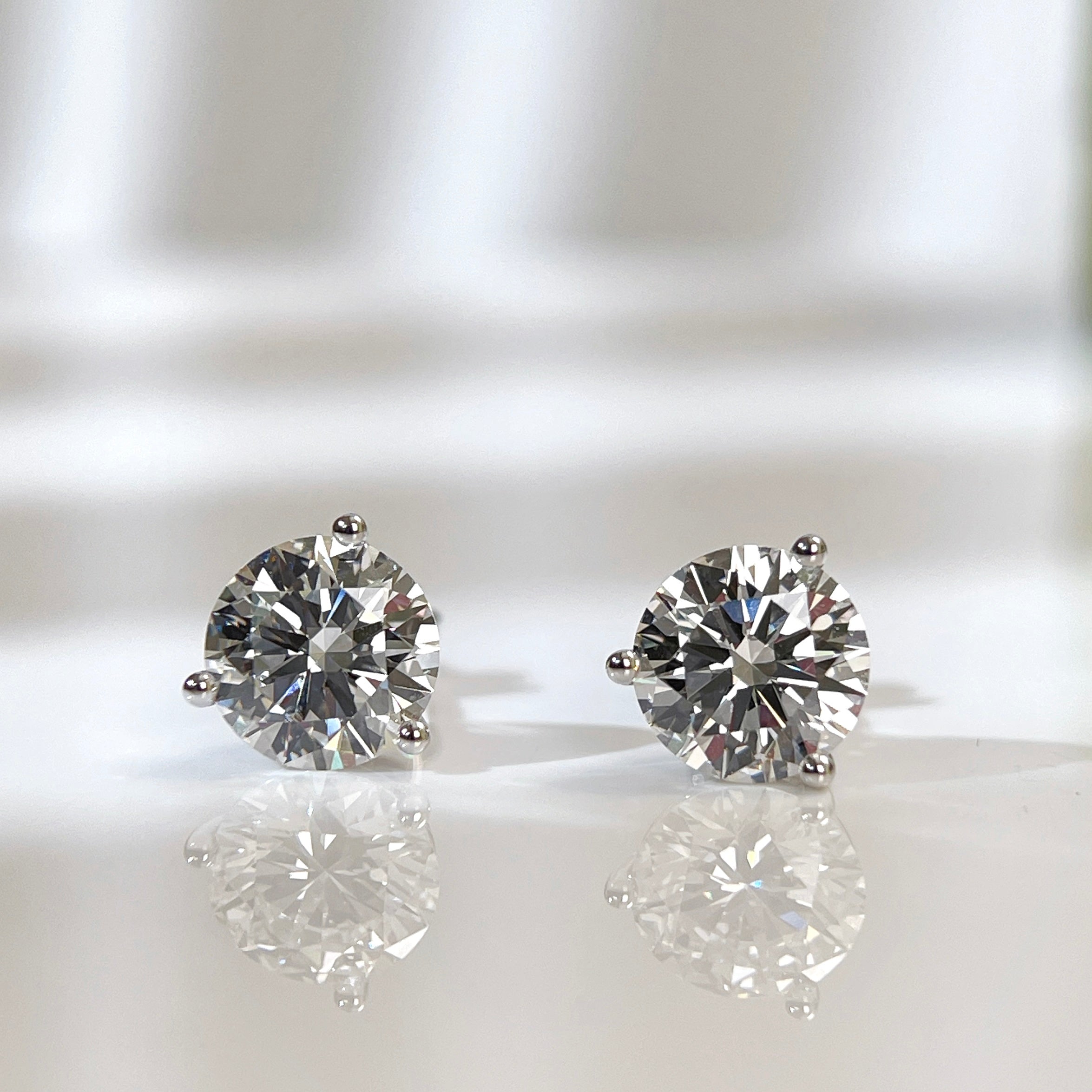 IGI certified 3 CTW round lab grown diamond three-prong Martini stud earrings in 18K white gold