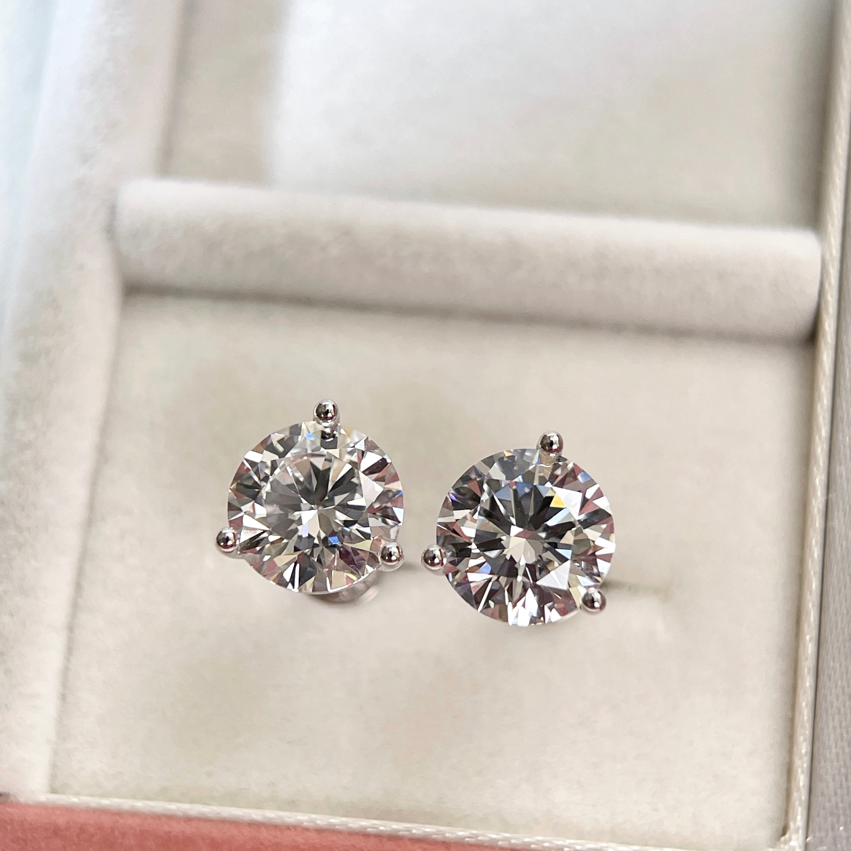 Front view of 3 CTW D VVS2 round lab grown diamond Martini stud earrings