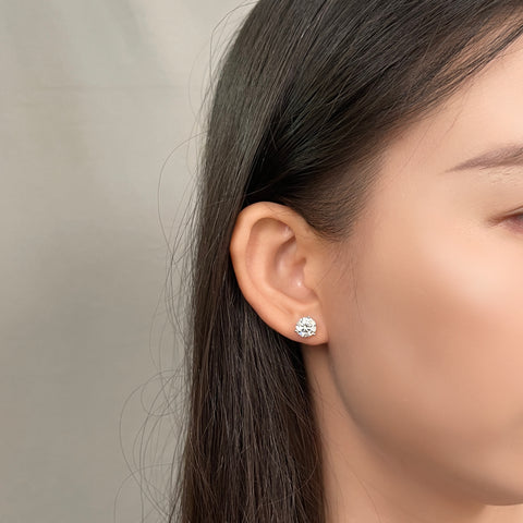 Model wearing 3 CTW round lab grown diamond three-prong Martini stud earrings