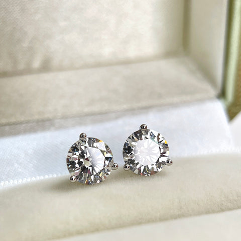Lifestyle display of IGI certified round lab grown diamond stud earrings