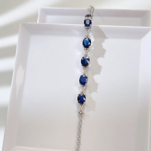 Oval Blue Sapphire Bracelet with X pave-set diamond